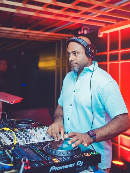 A shot of me working the Pioneer DJ decks during a packed Saturday night. I'm constantly tweaking the mix to keep the energy flowing and the crowd engaged.