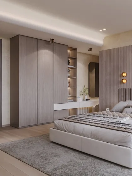 This shot shows the full layout of the bedroom, including the wardrobe and vanity area, emphasizing its spacious and functional design.