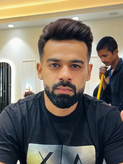 A fresh look for a fresh start. This client wanted a clean, professional style, so I delivered a sharp haircut with a defined side part and a perfectly groomed full beard.