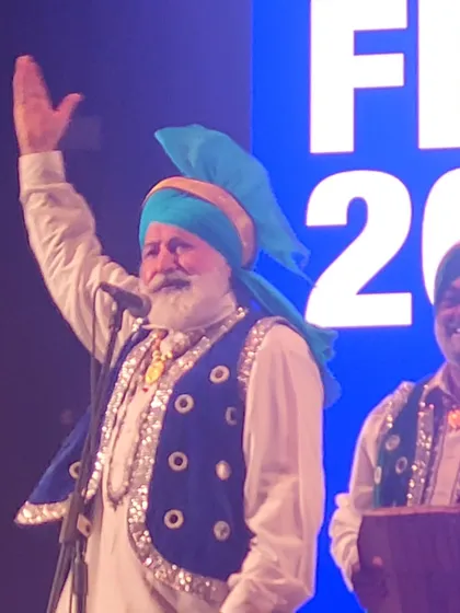 A senior artist from the Bhangra troupe, embodying the spirit of Punjab.