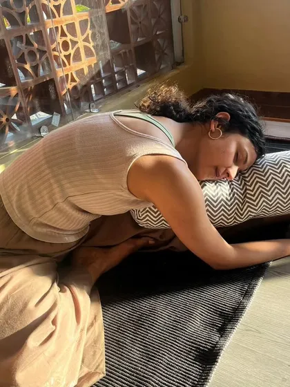 Sometimes, the practice is about slowing down and finding complete rest. Using props like a bolster in a restorative pose allows the body to release tension and the mind to find a state of deep calm and peace.