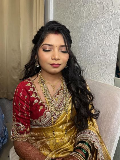 A close-up of the eye makeup, featuring a soft shimmer and winged liner that defines the eyes beautifully.