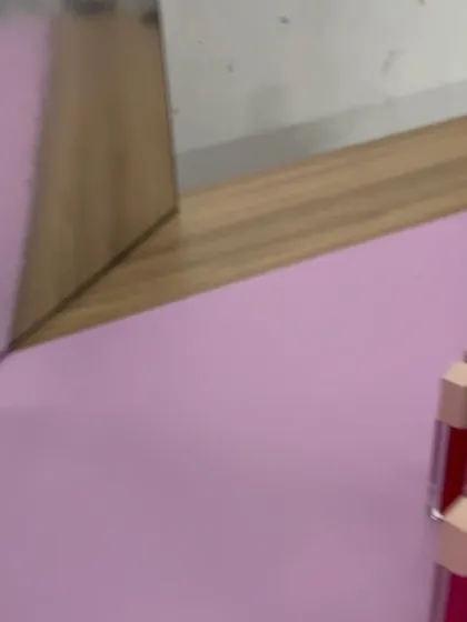 A behind-the-scenes glimpse of our pink-themed lipstick shoot, showing the arrangement and lighting.