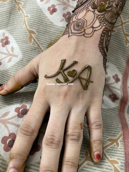 A sweet design with the initials 'K' and 'A' connected by a heart.
