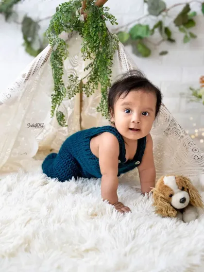 On the crawl with his little puppy friend. I love capturing these moments of movement and exploration during a baby's session.