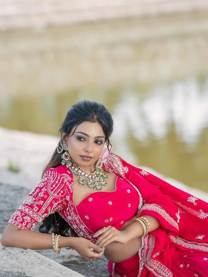 Another artistic outdoor shot of the pink lehenga, perfect for a portfolio.