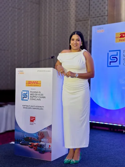 A poised stance next to the podium. I represent my clients' brands, like DHL Health Logistics, with utmost professionalism.