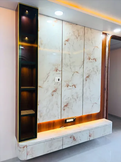Final look of the marble-finish TV unit, ready for the television to be mounted. The design is both beautiful and practical, with all necessary power outlets integrated.