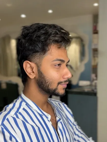 Another angle of this fresh look. You can see the clean lines and how the hair is styled for volume and texture.