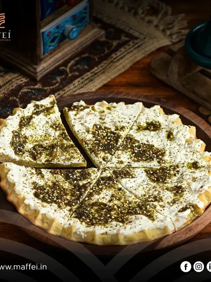 Our Labneh with Za'atar Manakeesh offers a delightful contrast of creamy, tangy labneh and the earthy, herbal flavor of za'atar on a crispy, chewy crust.