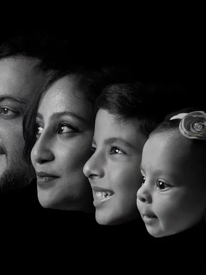 A legacy in a single frame. This artistic black and white composite portrait layers the profiles of a family, creating a powerful and modern heirloom that tells the story of generations.