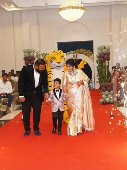 We can coordinate spectacular entrances for your event. Here, the birthday boy and his family make their grand entrance on a red carpet, complete with cold pyro sparklers and a friendly tiger mascot.