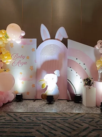 We love bringing whimsical themes to life, like this adorable bunny-themed event for Baby Arya. The setup features a custom rainbow backdrop, soft pastel balloon garlands, and a charming light-up bunny figure to create a dreamy atmosphere.