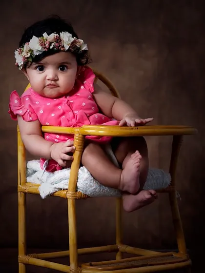My studio sessions offer a timeless, fine art look. The dramatic lighting and simple prop create a stunning, classic baby portrait.