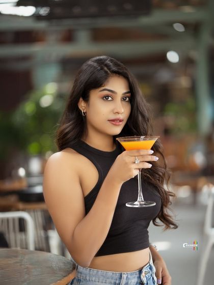 Another shot from the cafe series with Pooja Ramesh, this time interacting with a prop to create a more dynamic and engaging image.