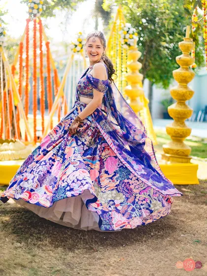A happy twirl from the bride at her outdoor Haldi ceremony. We capture the movement and flow of your beautiful outfits.