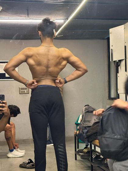 The locker room: where you see the results of your hard work. A post-workout shot showing a well-defined back, a product of consistency and dedication.