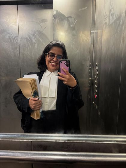 An elevator selfie on the way to court, files in hand. This is a typical moment in my day, capturing the constant motion of a litigator's life.