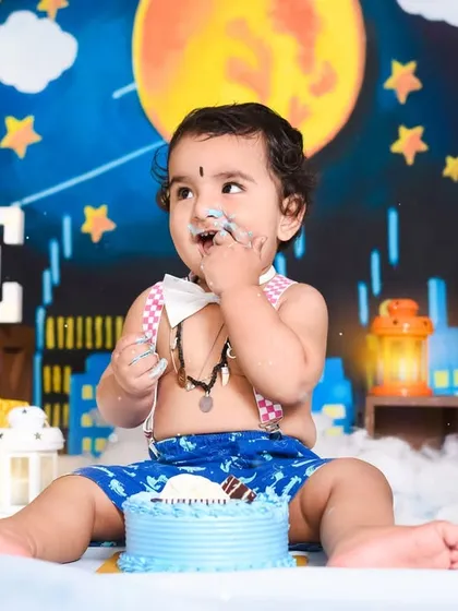 A little taste of birthday cake is the perfect treat. This moment captures the curiosity and delight of a baby trying his birthday cake for the very first time.