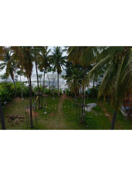 The same beautiful view of our camp, showing the open space for games and activities with the water in the background.