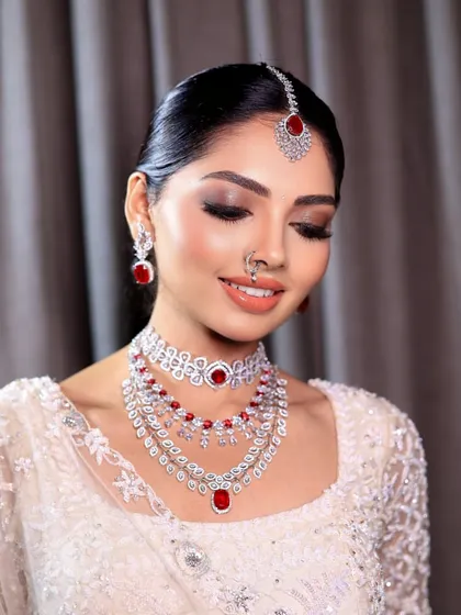 This is the essence of my signature bridal glam. The focus is on creating a flawless, radiant complexion with soft, defined eyes and lips that enhance the bride's natural beauty, ensuring she looks timeless in her wedding photos.