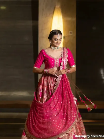 A full-length shot showing the beautiful drape of her Garba lehenga. The makeup and hair are designed to stay put through a night of energetic dancing.