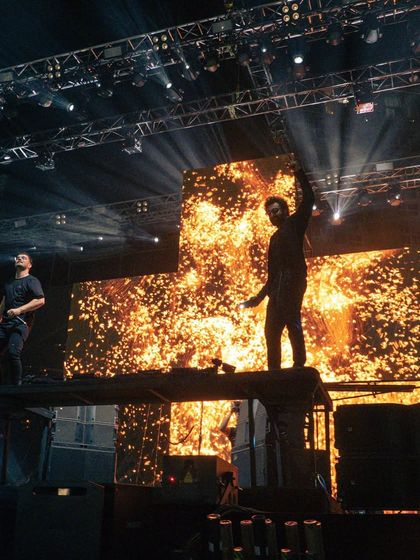 A fiery shot of Martin Garrix and Ranbir Kapoor on stage together, a moment of pure star power.