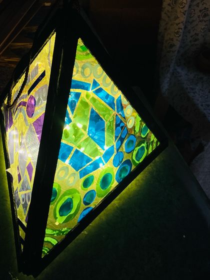 This lit lantern shows how the different colors and textures play with light, creating a stunning visual effect.