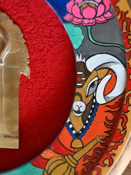 A close-up detail of the Mangal (Mars) frame, showing the hand-painted ram, the deity's mount. The fiery colors and powerful imagery reflect the war-like energy and strength associated with this planet.