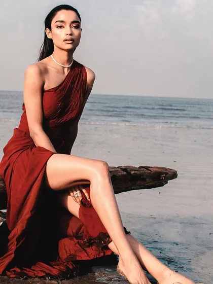 A closer look at the elegant draping and rich color of this one-shoulder evening dress. The design is both modern and timeless, ensuring you look and feel incredible for your special occasion. Renting this piece means you get all the glamour without the commitment.