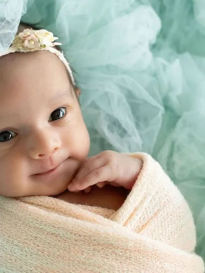 That curious, wide-eyed gaze is one of my favorite things to capture. This simple, beautiful portrait shows off your baby's emerging personality, a fleeting moment preserved forever.