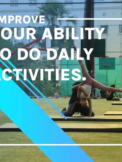 Gymnastics improves your ability to do daily activities by enhancing coordination and strength. Here, a student performs an assisted aerial.