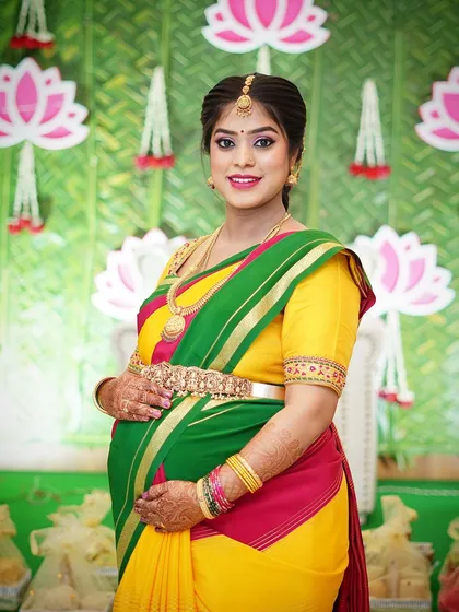 A full-length shot of Preethi, glowing and happy, at her baby shower.