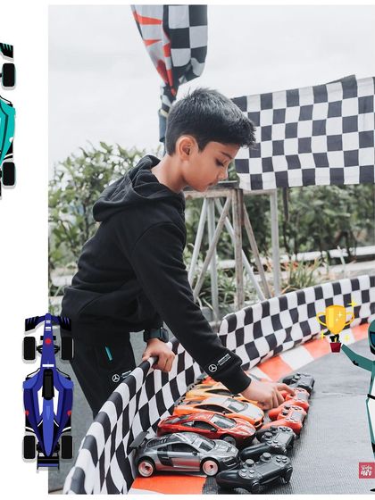 The birthday boy, Vihaan, setting up his own race on a miniature track. I love creating interactive stations where kids can play and live out the party's theme.