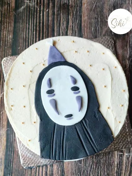 For the anime lovers, I create detailed character art like this No-Face from Spirited Away. This design uses carefully layered fondant on a buttercream cake to bring the iconic character to life for a truly special birthday treat.