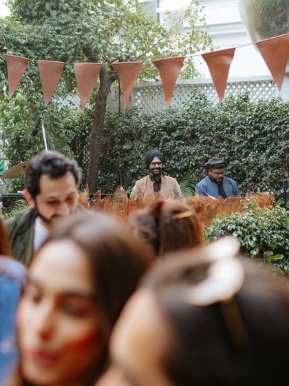 A view from the crowd's perspective, showing me in my element during a beautiful outdoor party.