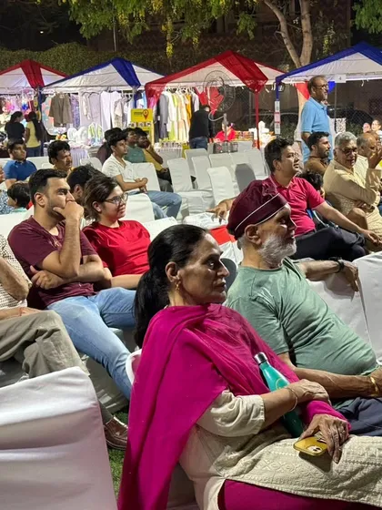An engaged audience watching a performance at our outdoor festival in Heritage City, Gurgaon. We arrange for comfortable seating and a great view of the stage for all guests.