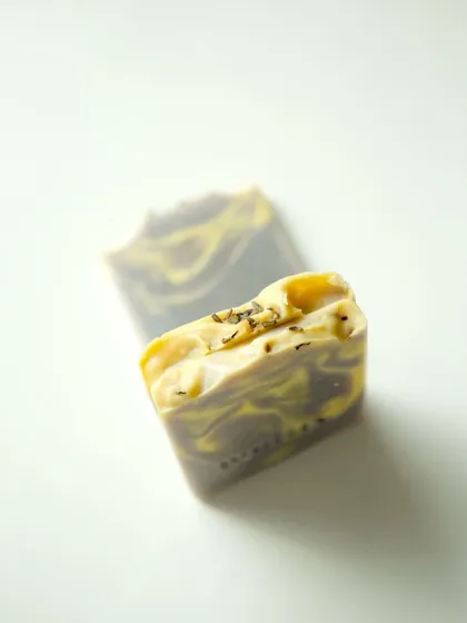 A single soap end, showing the beautiful yellow and purple swirls from natural colorants.