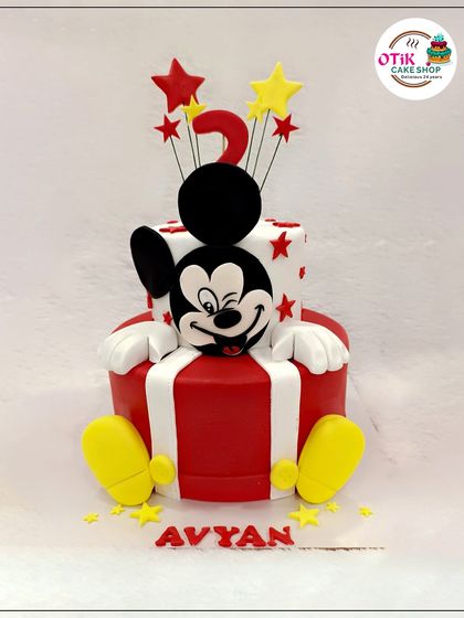 We brought the magic of Disney to this two-tiered birthday cake with a hand-sculpted Mickey Mouse figure. The classic red, white, and yellow colors make it a timeless choice for a joyful celebration.