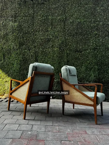 Back view of the high-back lounge chairs, showing the stud detailing.