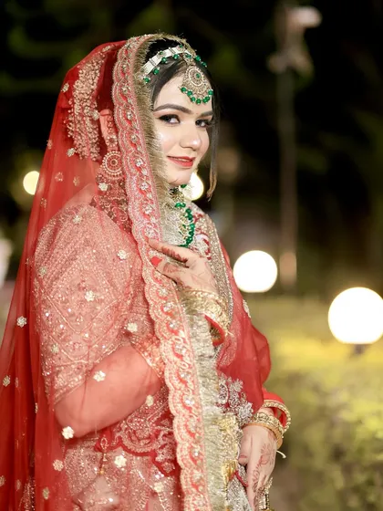 A side profile showcasing the intricate hair and makeup details. Every element is carefully crafted for a complete and cohesive bridal look.