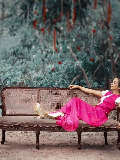 This look is from my 'Passage to India' concept, blending modern style with heritage details. I designed this fuchsia pink pleated maxi dress with an off-shoulder, embroidered v-shaped neckline. It's an indie-chic outfit that’s perfect for a unique cocktail party or destination wedding event.