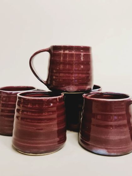 Another shot of the burgundy-glazed mugs. You can find these and other designs at my stall at The Lil Flea market.
