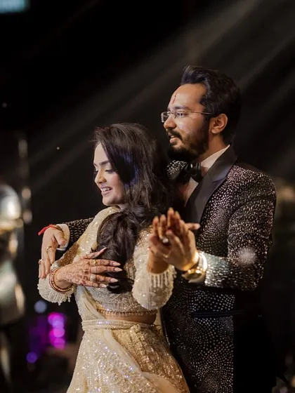 The couple shares a moment on stage, surrounded by backup dancers. We can create a full production for your special performance.