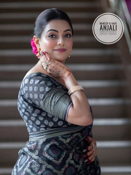 In the mood for glam. My artist Anjali created this sophisticated look with a printed saree and a classic bun, perfect for any party or event.