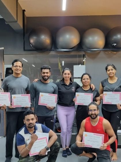 A proud group of students holding their certificates after completing our Mobility and Recovery Exercise workshop.