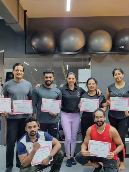 A proud group of students holding their certificates after completing our Mobility and Recovery Exercise workshop.