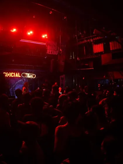 The whole club is bathed in red light, creating a powerful, immersive experience.