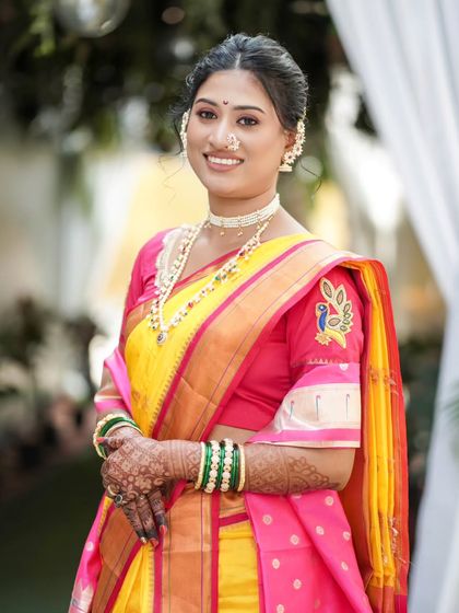 A bright and beautiful portrait of the bride, smiling warmly at the camera.