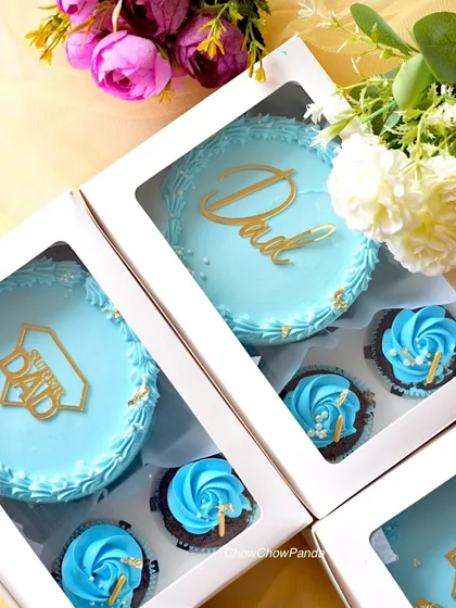Here are a few of the Father's Day hampers I made, featuring mango-flavoured bento cakes. Each set was personalized with a different 'Dad' themed topper and matching blue cupcakes.